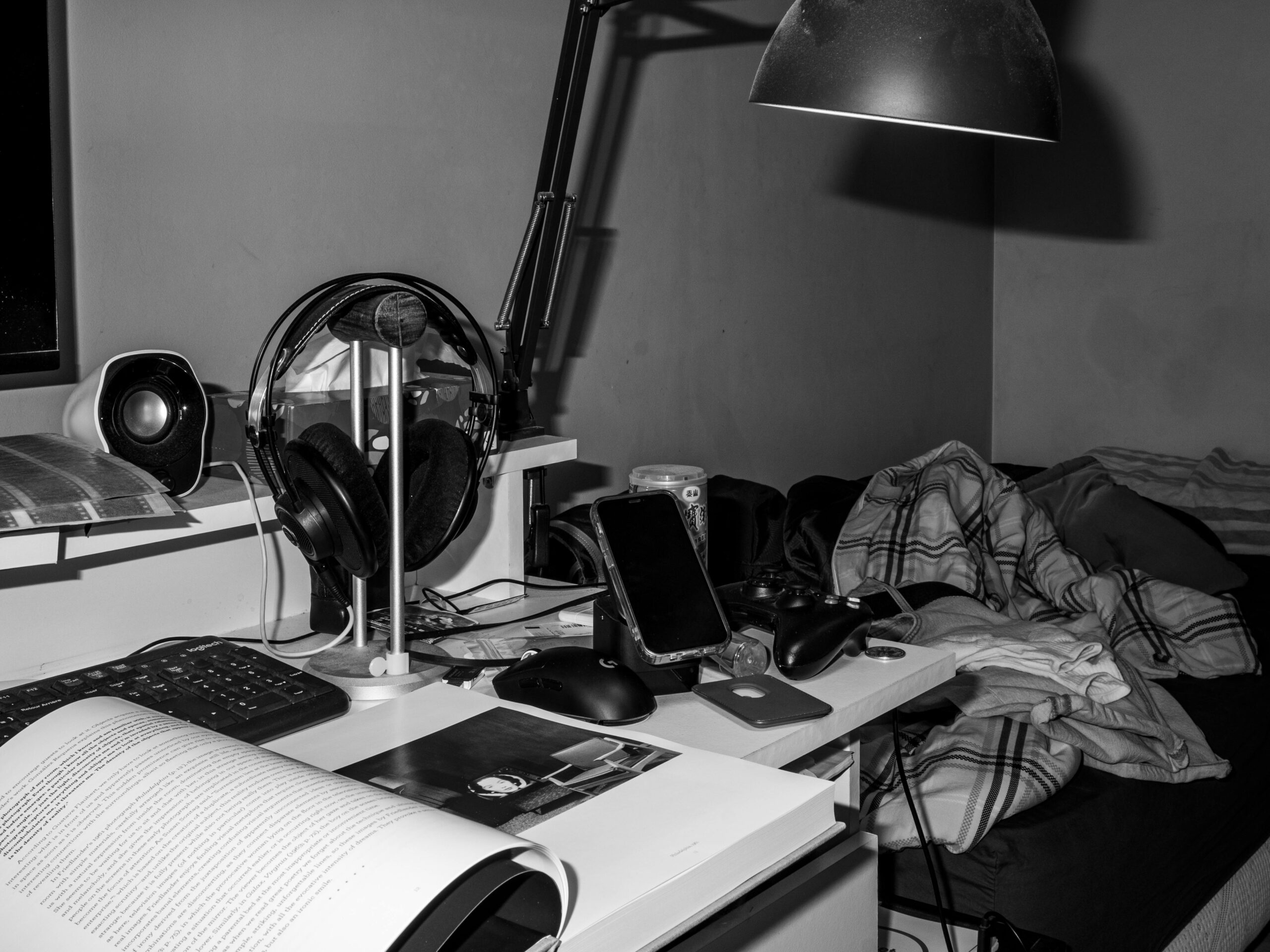 A well-designed home office featuring a smart standing desk, adjustable monitor arms, and soft ambient lighting.