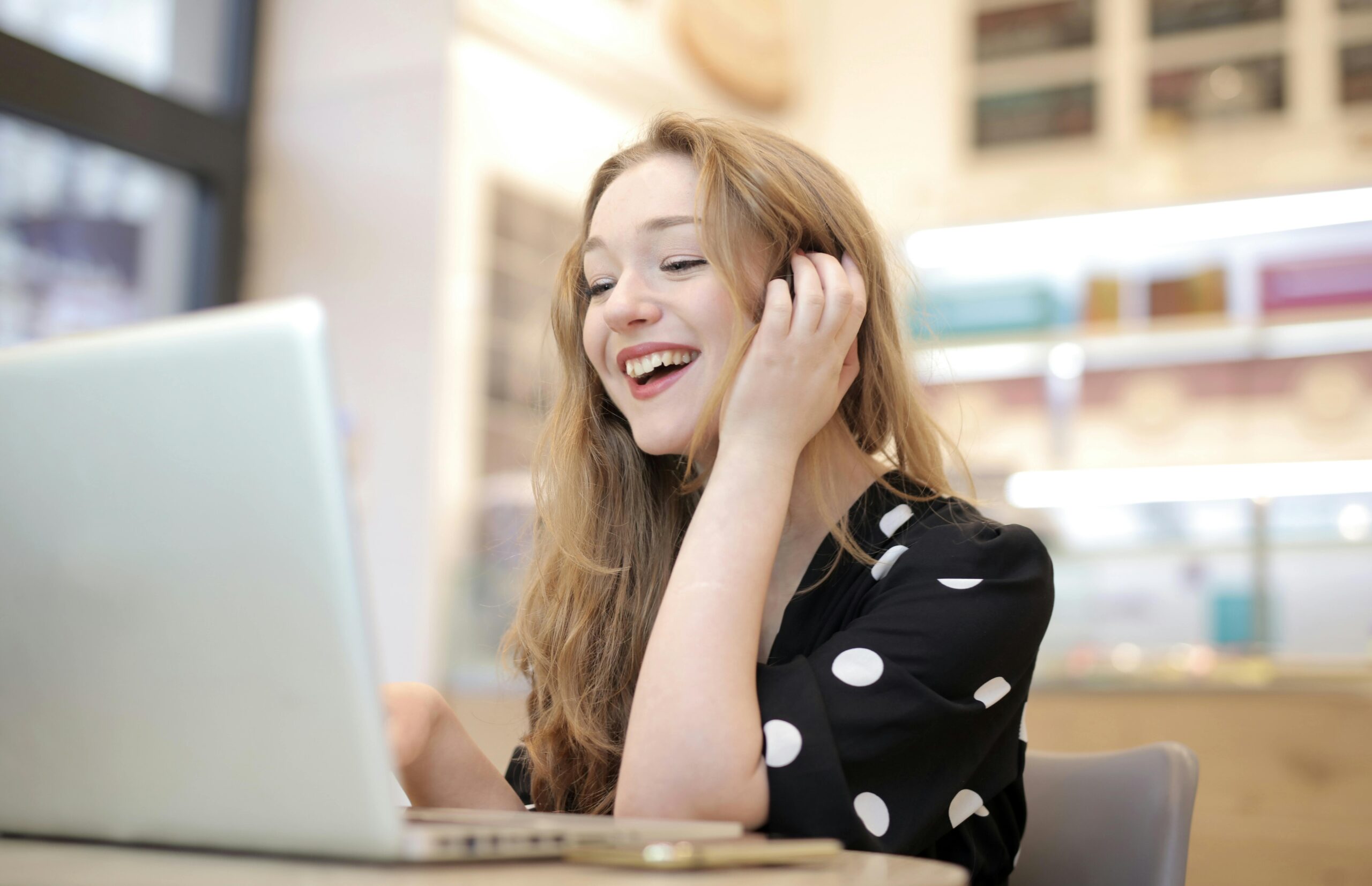 Woman using a Bluetooth-connected standing desk with ease