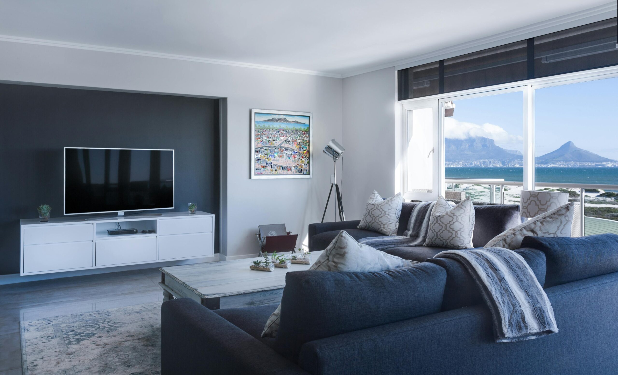 A living room featuring multiple pieces of app-controlled smart furniture