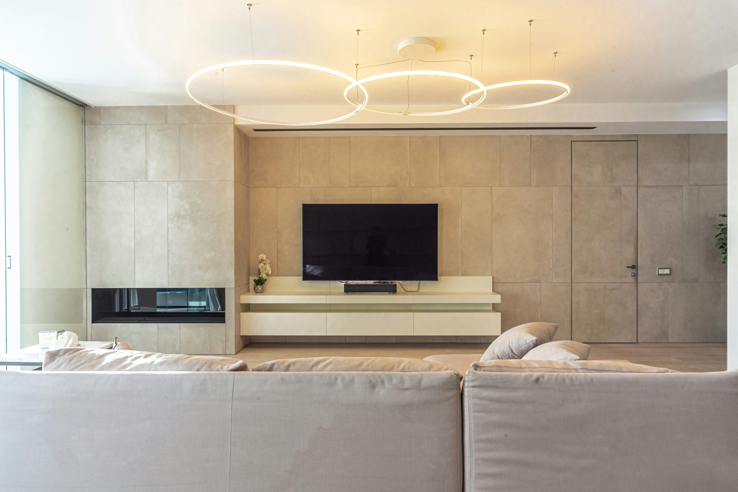 A modern living room with integrated smart lighting in furniture