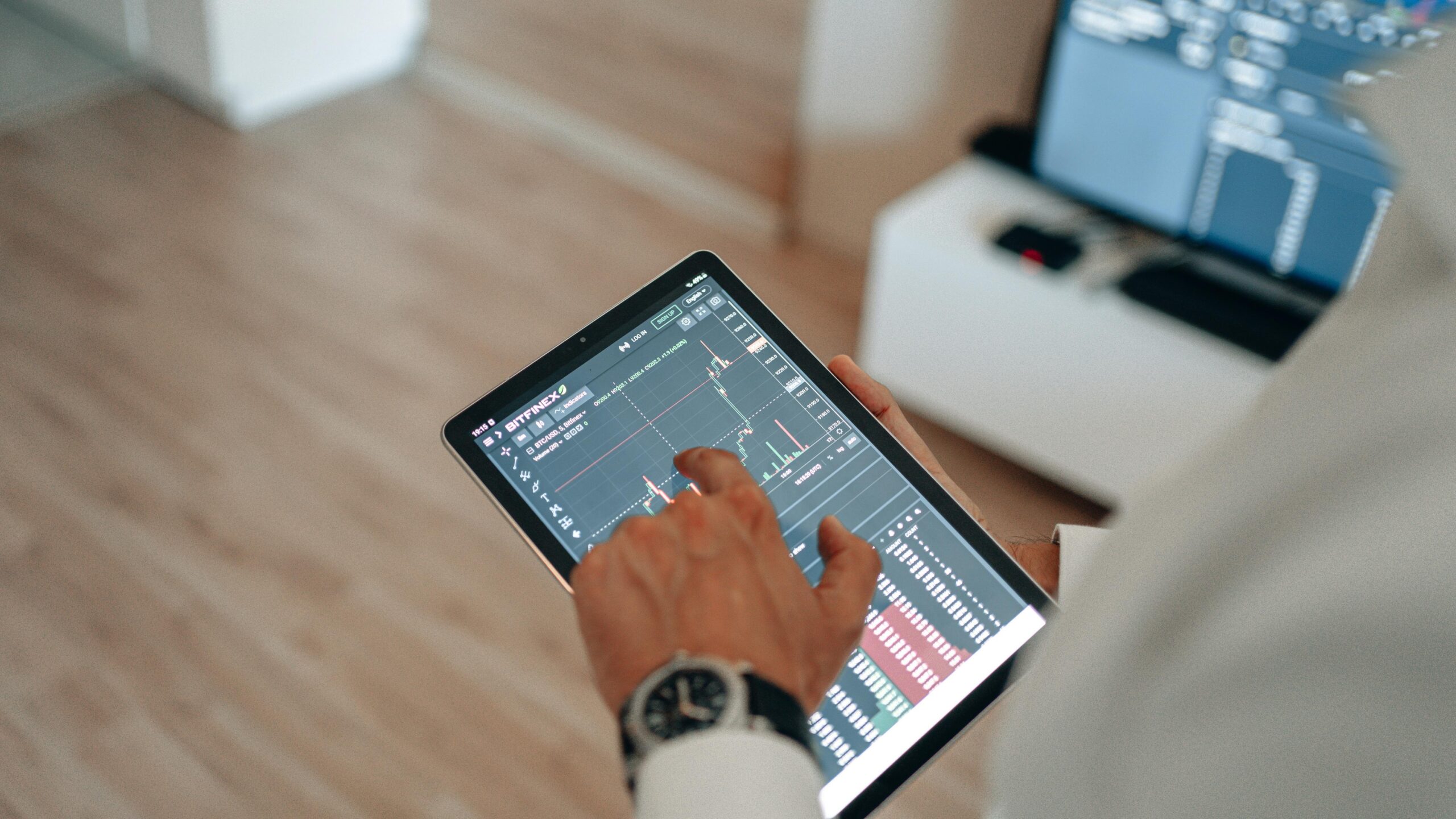 A person holding a tablet showing detailed Wi-Fi signal strength analysis.