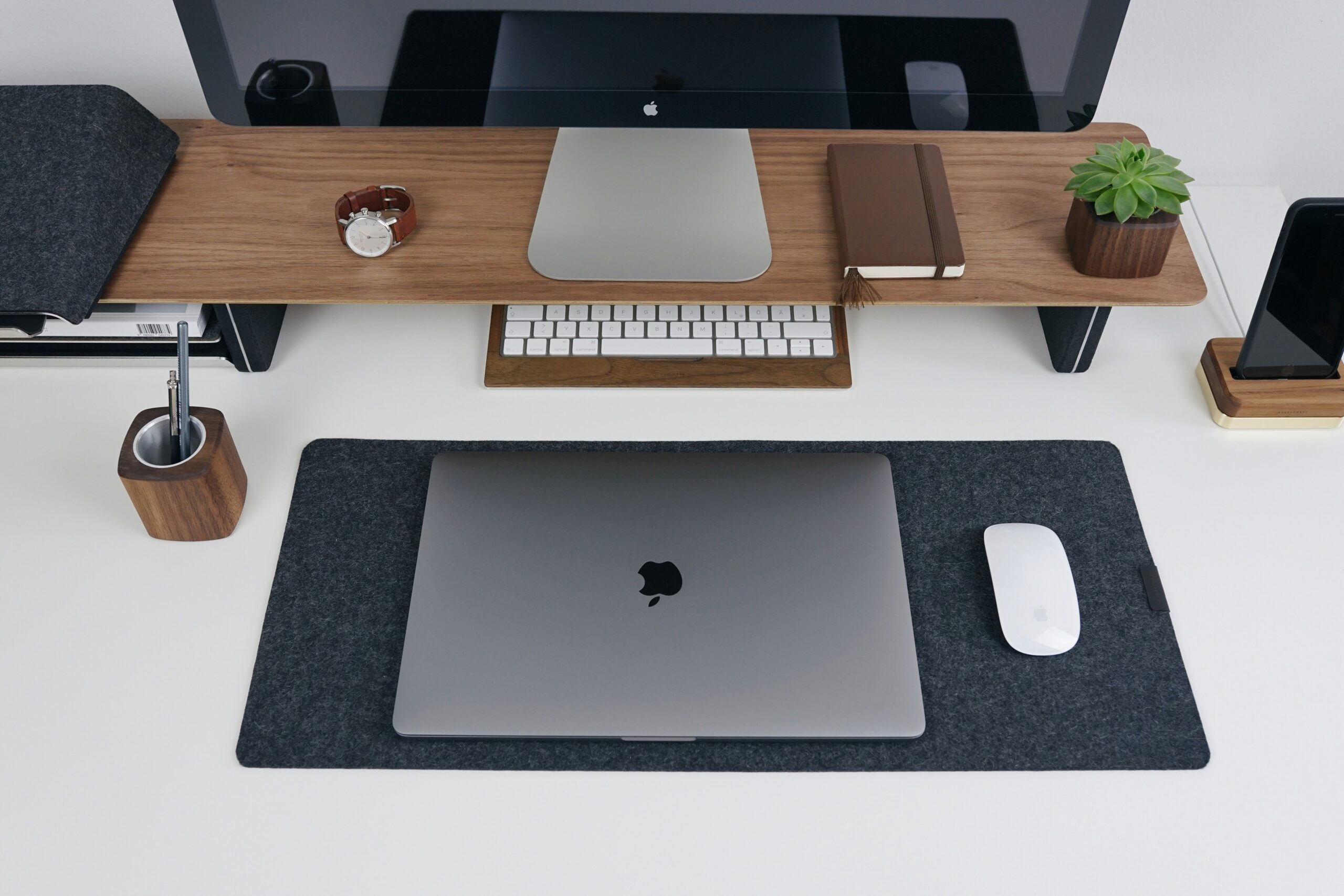 An ergonomic workspace with a smart standing desk and wireless charging surfaces