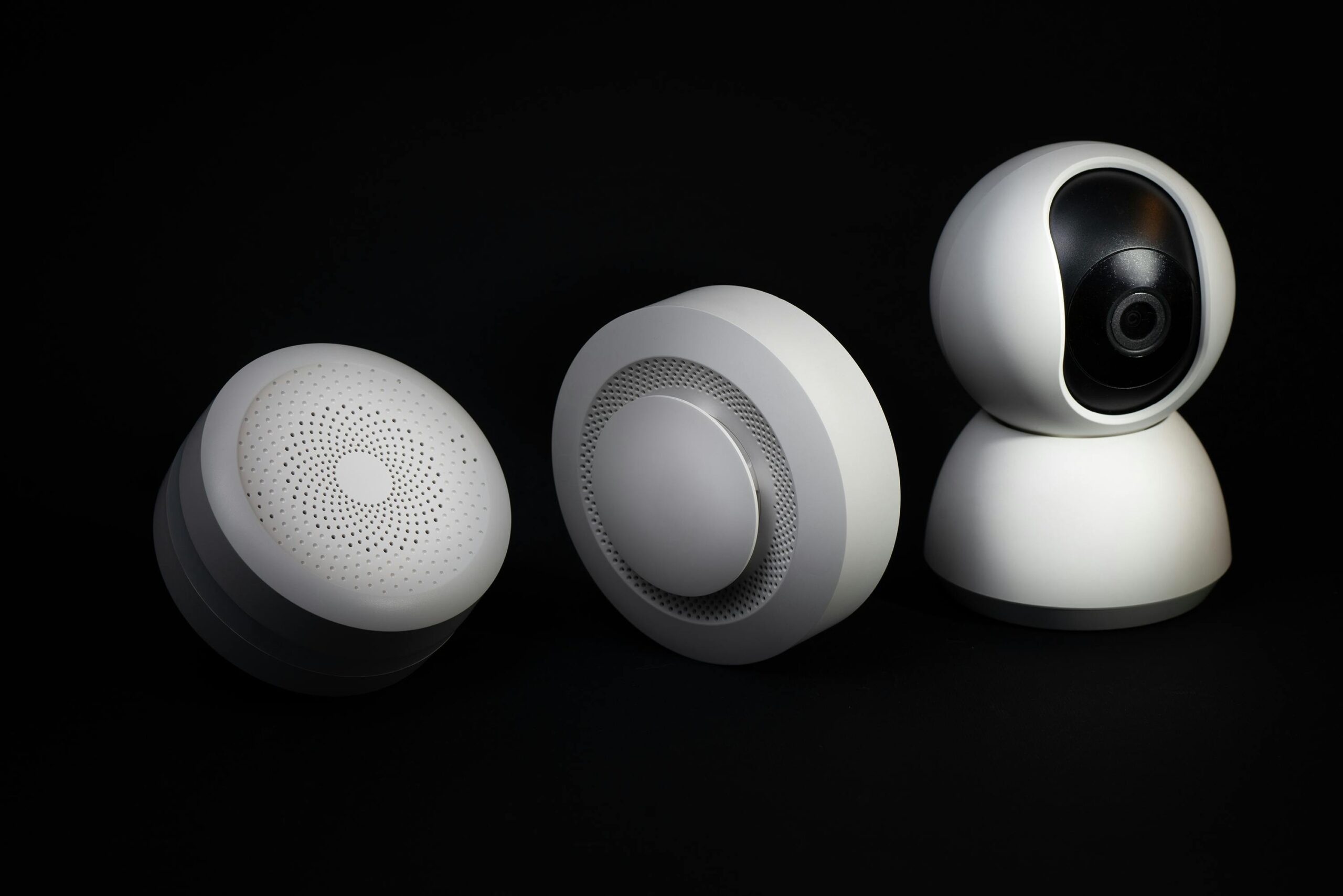 Illustration of a voice assistant communicating wirelessly with multiple smart household items including chairs and desks.