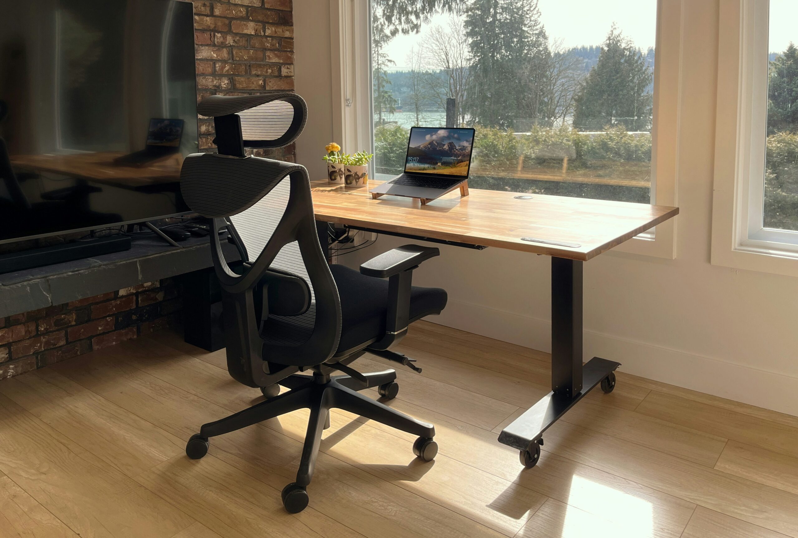 Modern home office featuring Bluetooth-enabled standing desk and ergonomic chair
