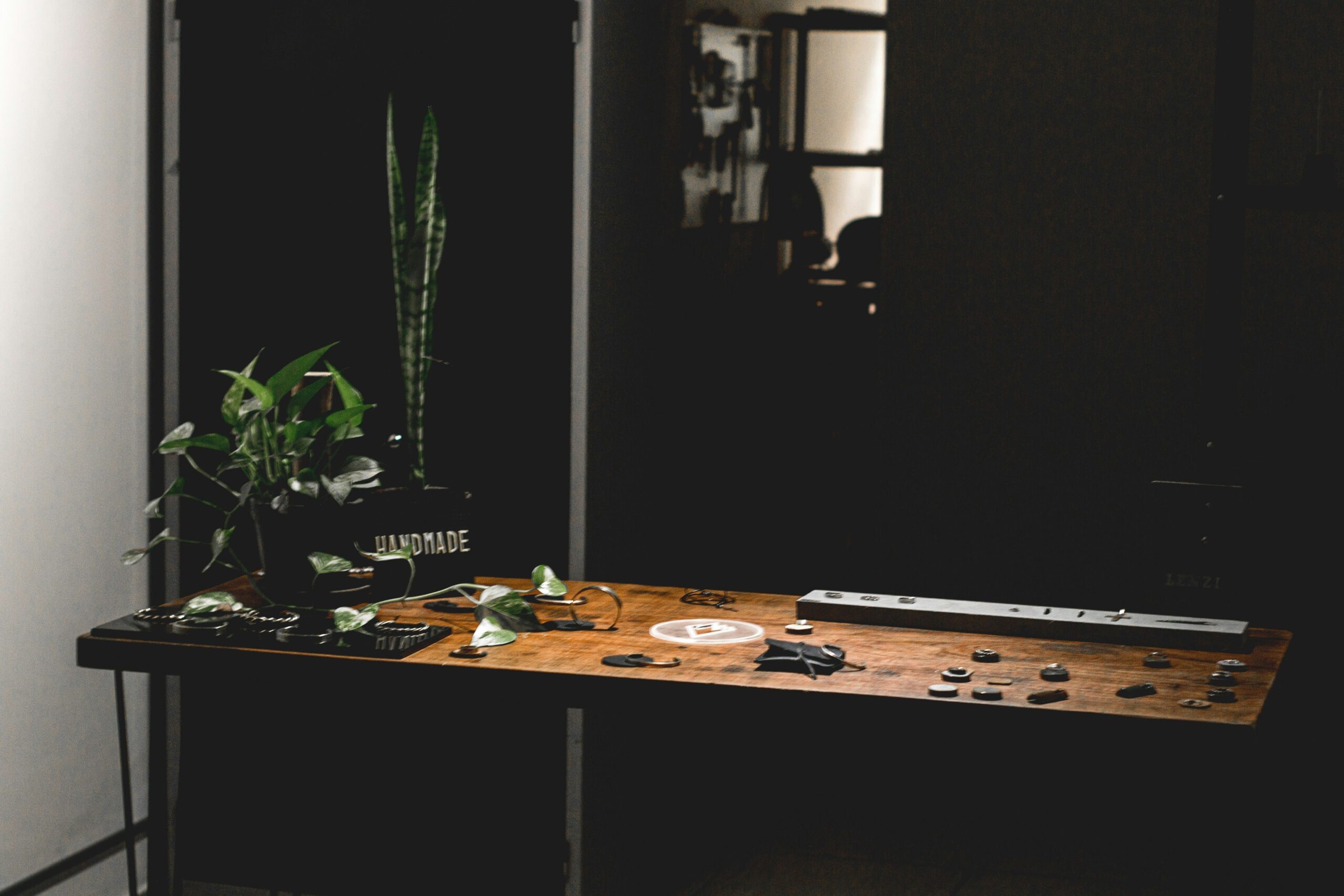 A sleek wooden desk with integrated solar panels and wireless chargers