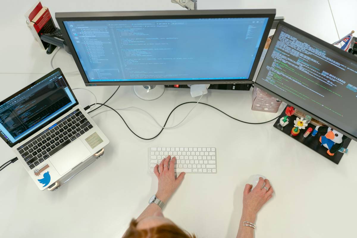 A sleek, modern smart desk equipped with USB ports and wireless charging pad