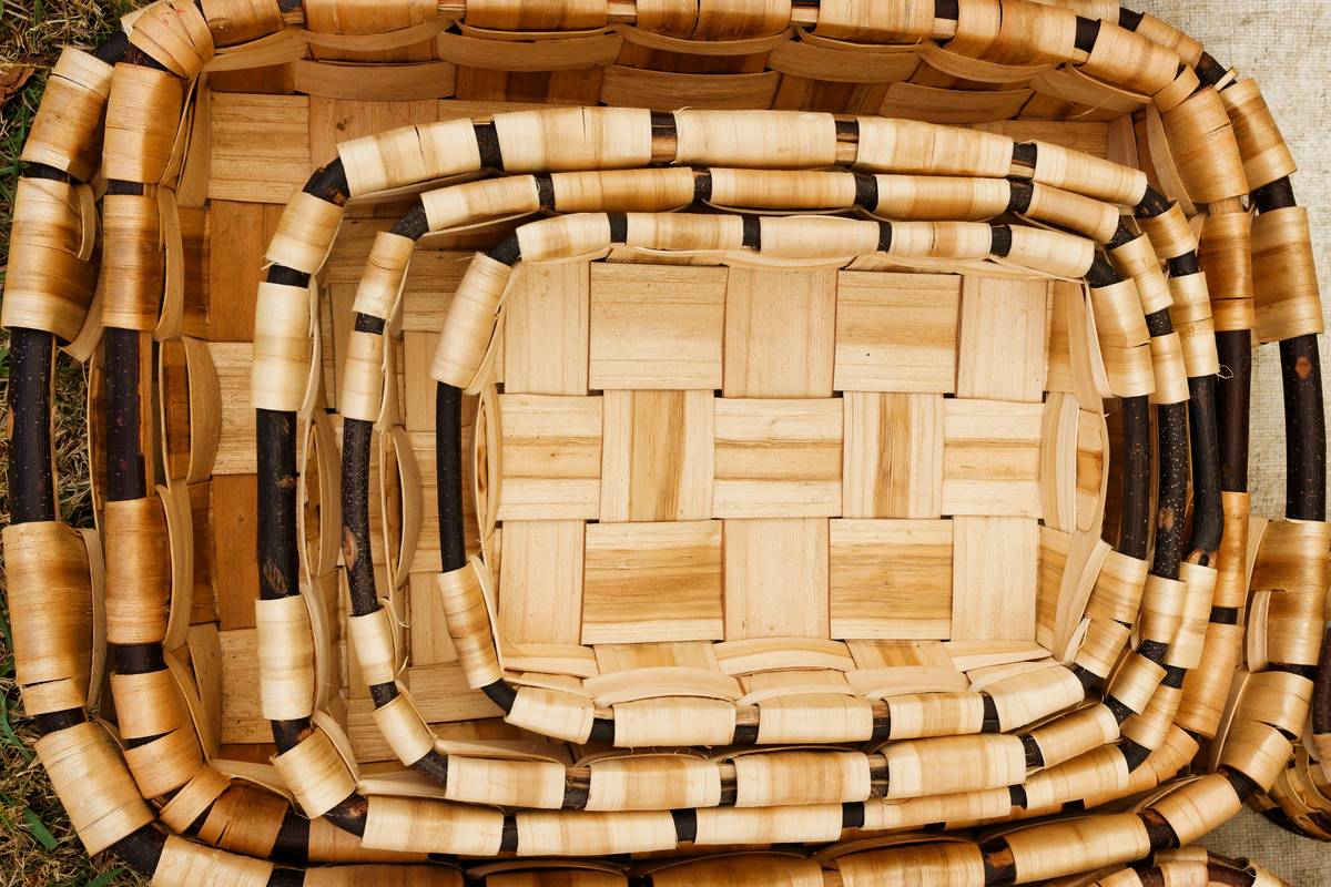 Pile of discarded wooden and upholstered furniture in a landfill