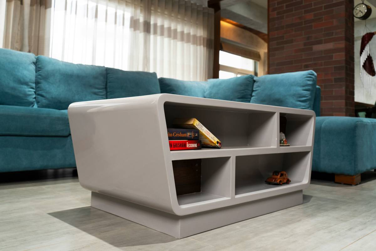 A minimalist desk with integrated LED lights and wireless charging pads.
