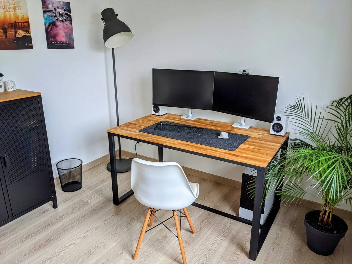 A sleek wooden desk with adjustable legs and integrated USB ports.