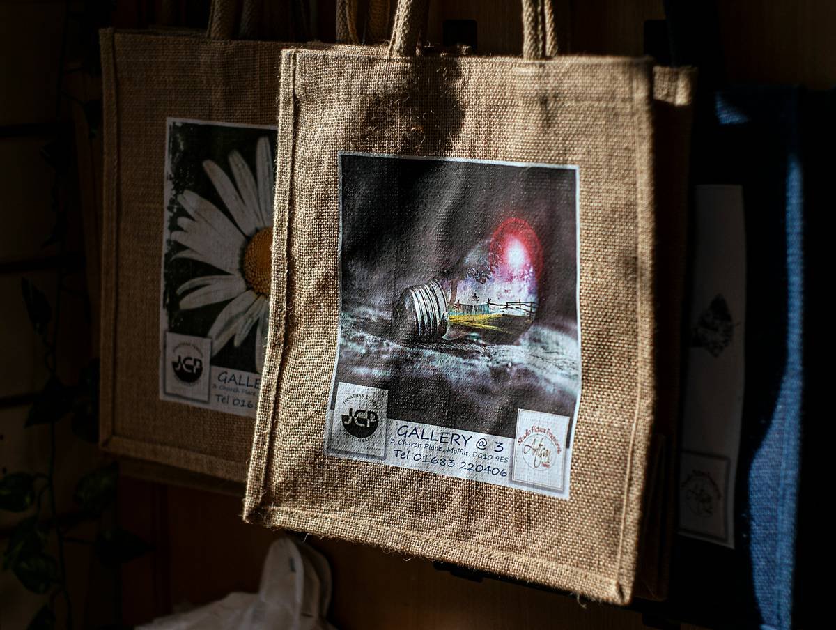 A modern shelf unit made from bamboo with embedded LED lights and charging ports.