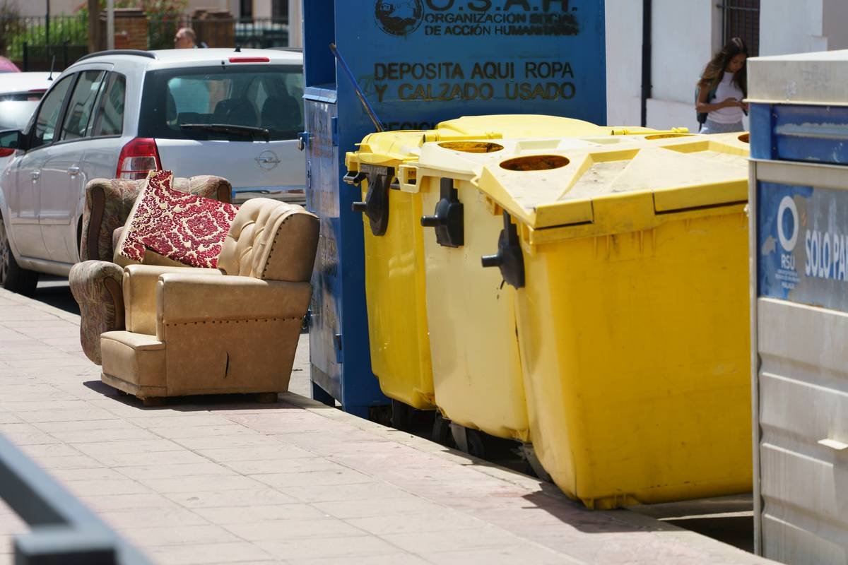 A sleek smart couch abandoned due to non-recyclable components